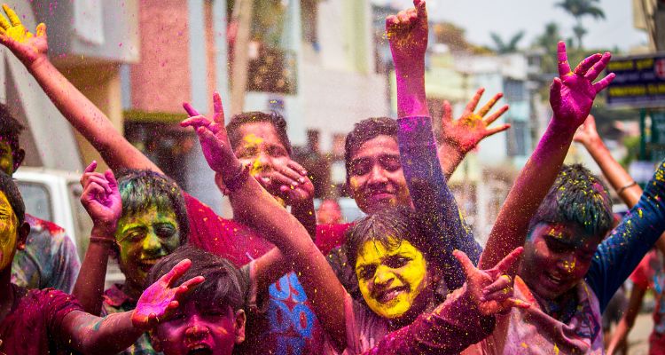 People celebrating Holi festival of colors.